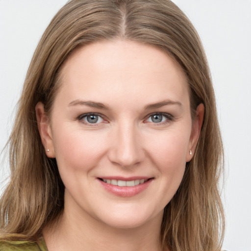 Joyful white young-adult female with long  brown hair and grey eyes