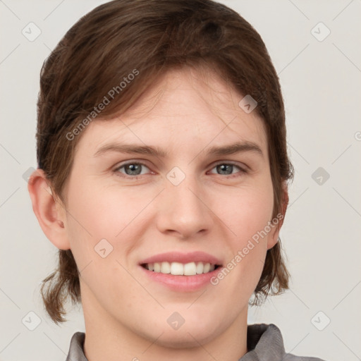 Joyful white young-adult female with medium  brown hair and grey eyes