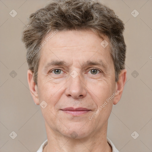 Joyful white adult male with short  brown hair and grey eyes