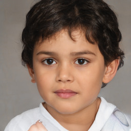 Joyful white child male with short  brown hair and brown eyes