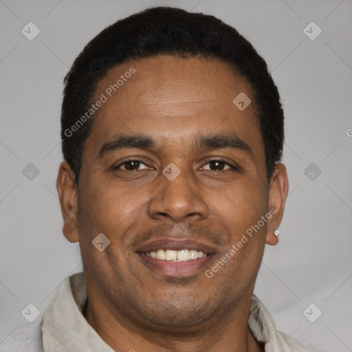 Joyful latino adult male with short  brown hair and brown eyes