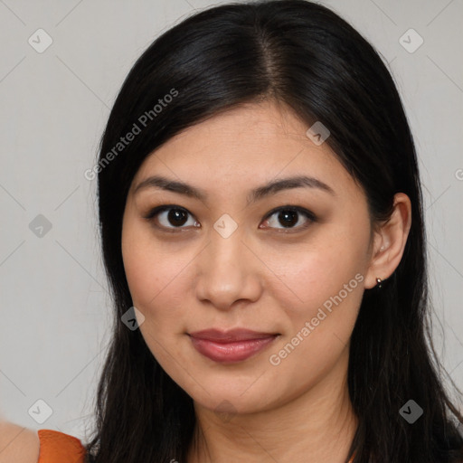 Joyful latino young-adult female with long  brown hair and brown eyes