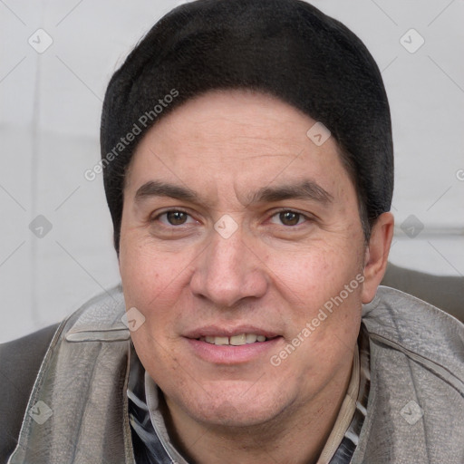 Joyful white adult male with short  black hair and brown eyes