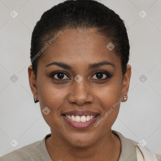 Joyful black young-adult female with short  black hair and brown eyes