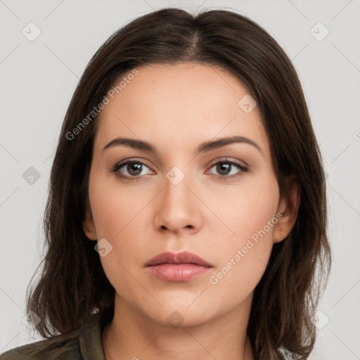 Neutral white young-adult female with long  brown hair and brown eyes