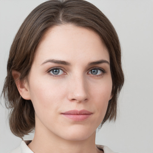 Neutral white young-adult female with medium  brown hair and grey eyes