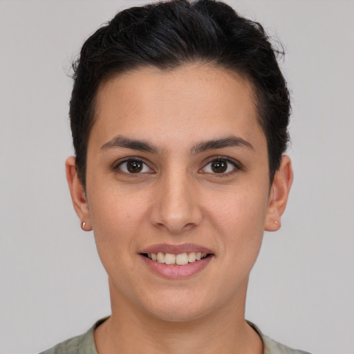 Joyful white young-adult female with short  brown hair and brown eyes
