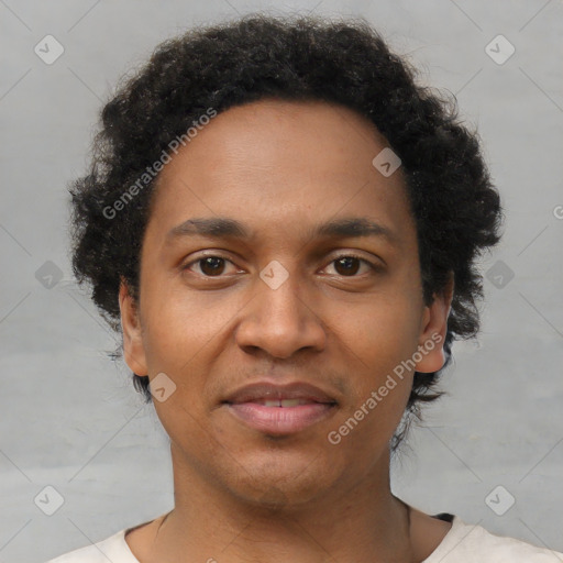 Joyful black young-adult male with short  brown hair and brown eyes