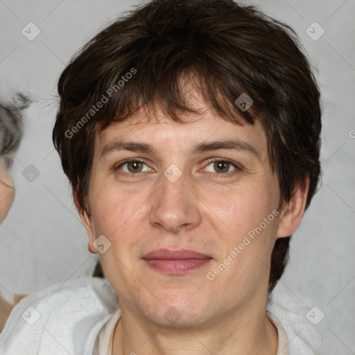 Joyful white adult male with medium  brown hair and brown eyes