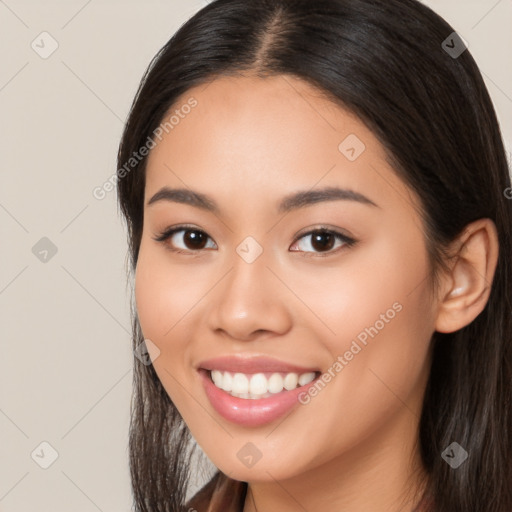 Joyful white young-adult female with long  brown hair and brown eyes