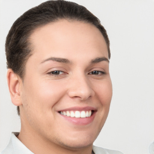 Joyful white young-adult female with short  brown hair and brown eyes