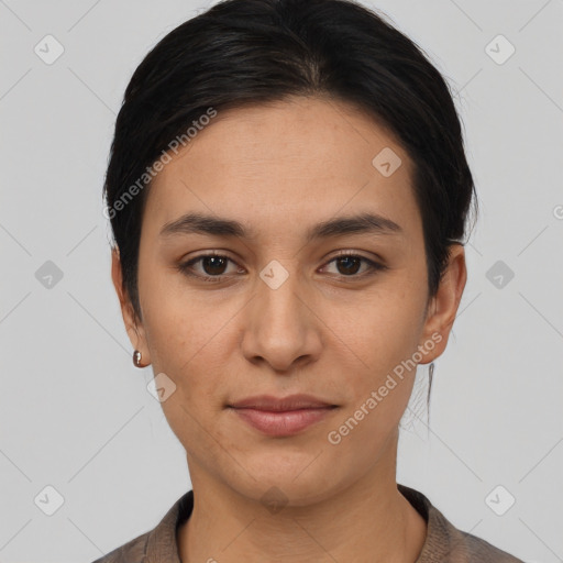 Joyful latino young-adult female with short  brown hair and brown eyes