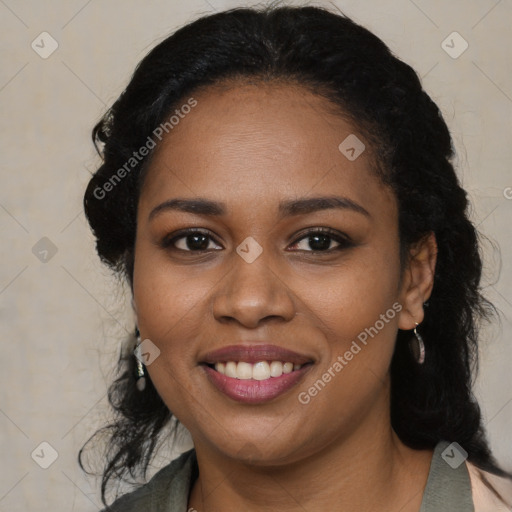 Joyful black young-adult female with long  black hair and brown eyes