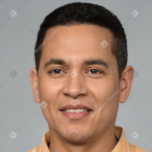 Joyful latino adult male with short  black hair and brown eyes