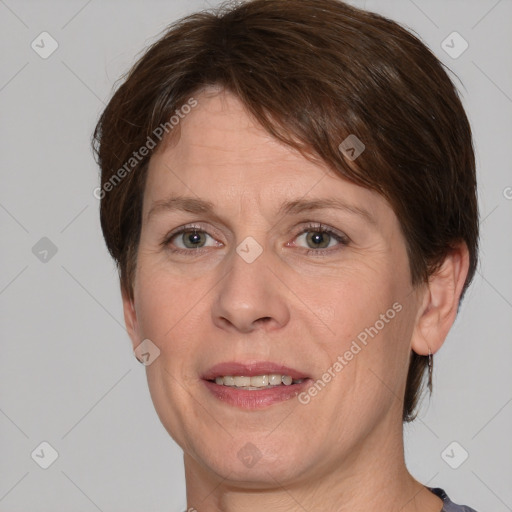 Joyful white adult female with short  brown hair and grey eyes