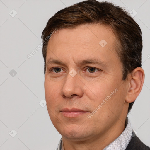 Joyful white adult male with short  brown hair and brown eyes