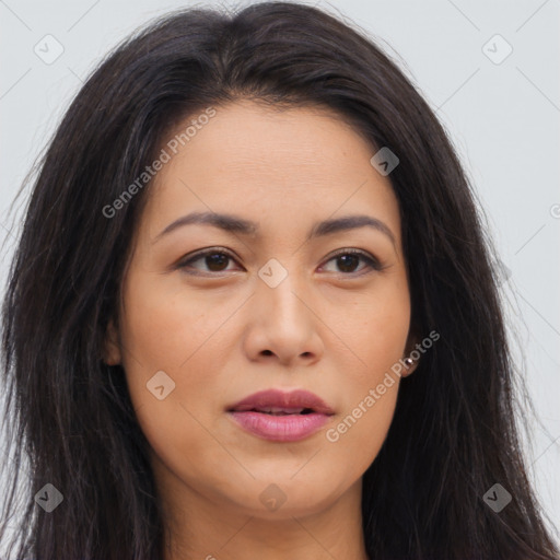 Joyful asian young-adult female with long  brown hair and brown eyes