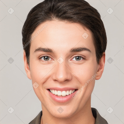 Joyful white young-adult female with short  brown hair and brown eyes