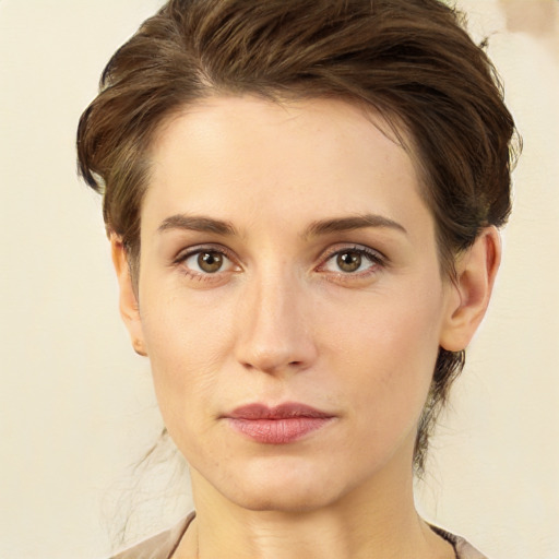 Joyful white young-adult female with medium  brown hair and green eyes