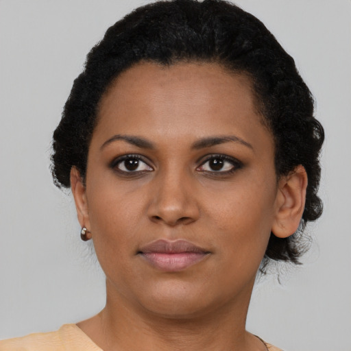Neutral black young-adult female with short  brown hair and brown eyes