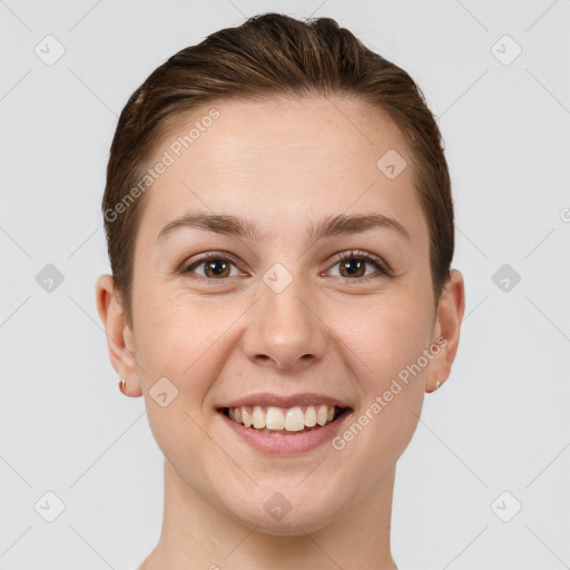 Joyful white young-adult female with short  brown hair and brown eyes