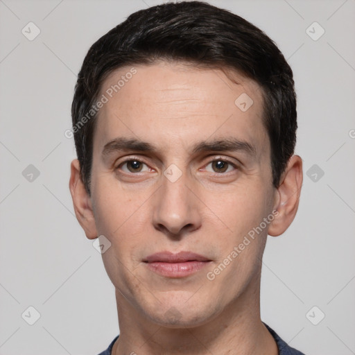 Joyful white young-adult male with short  black hair and brown eyes