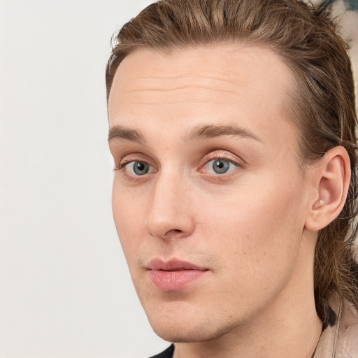 Neutral white young-adult male with long  brown hair and blue eyes