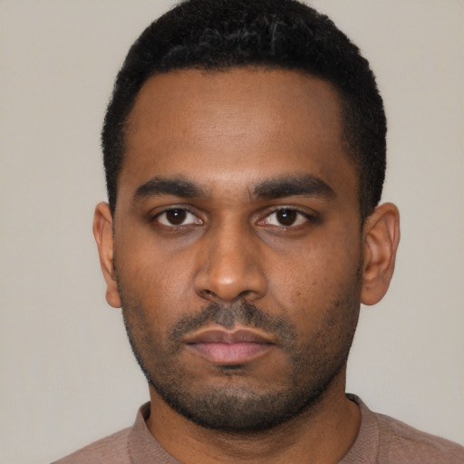 Neutral latino young-adult male with short  black hair and brown eyes
