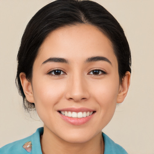 Joyful white young-adult female with long  black hair and brown eyes