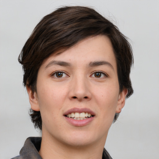 Joyful white young-adult female with short  brown hair and brown eyes