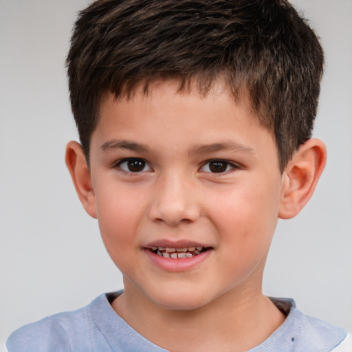 Joyful white child male with short  brown hair and brown eyes