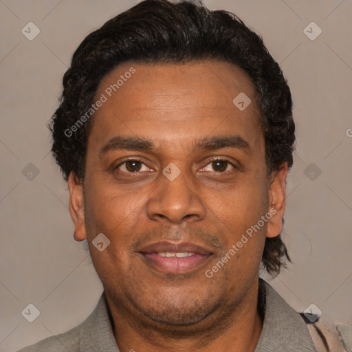 Joyful latino adult male with short  black hair and brown eyes