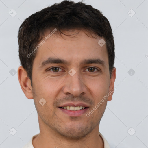 Joyful white young-adult male with short  brown hair and brown eyes