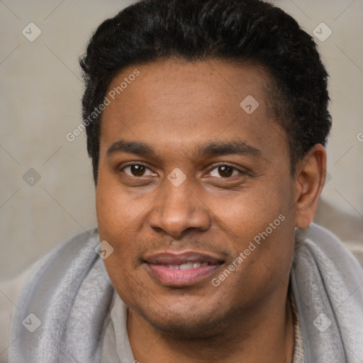 Joyful latino young-adult male with short  brown hair and brown eyes