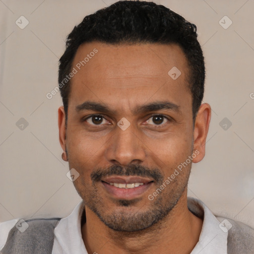 Joyful white adult male with short  black hair and brown eyes