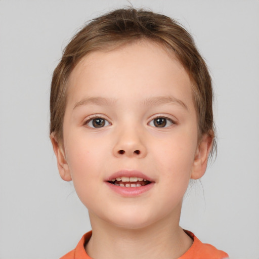 Joyful white child female with short  brown hair and brown eyes