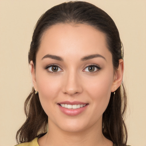 Joyful white young-adult female with long  brown hair and brown eyes