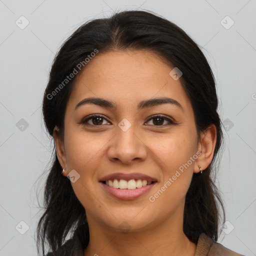 Joyful latino young-adult female with long  brown hair and brown eyes