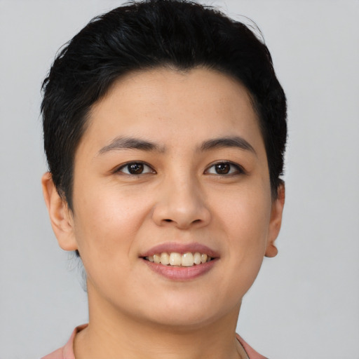 Joyful asian young-adult female with short  black hair and brown eyes