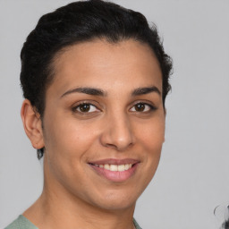 Joyful latino young-adult female with short  brown hair and brown eyes