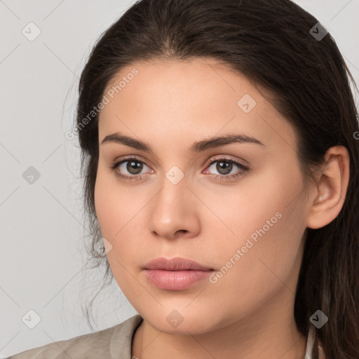 Neutral white young-adult female with long  brown hair and brown eyes