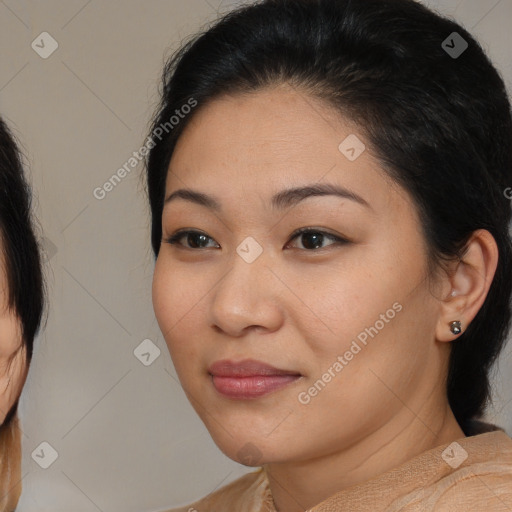 Joyful latino young-adult female with medium  brown hair and brown eyes