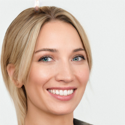 Joyful white young-adult female with medium  brown hair and blue eyes