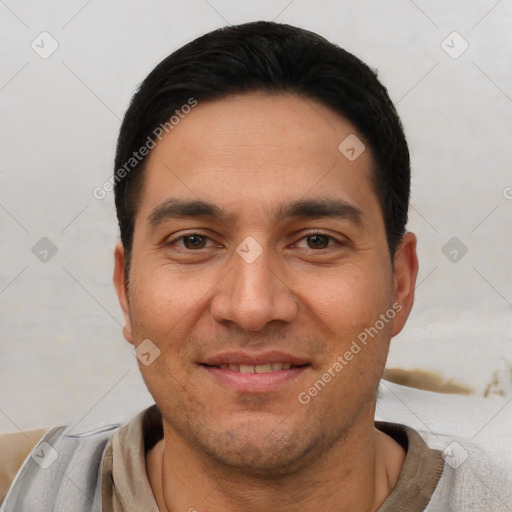 Joyful white young-adult male with short  black hair and brown eyes