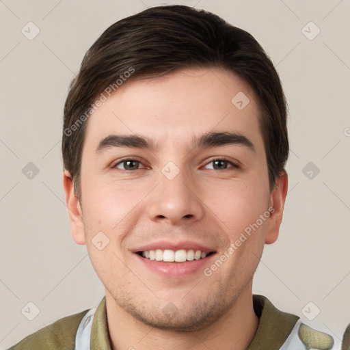 Joyful white young-adult male with short  brown hair and brown eyes