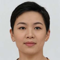 Joyful asian young-adult female with short  brown hair and brown eyes