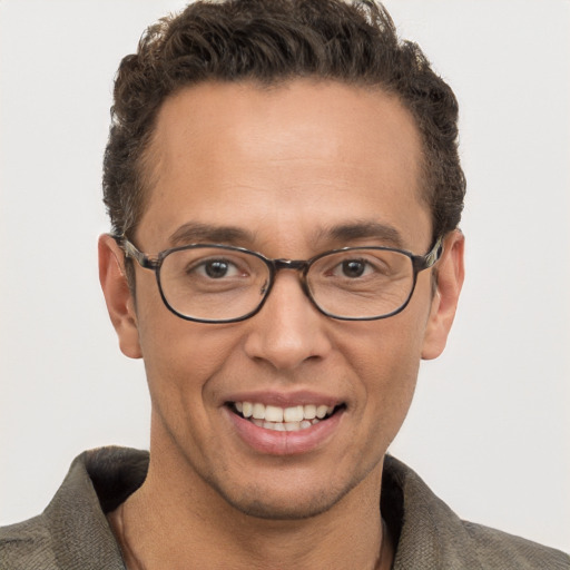 Joyful white adult male with short  brown hair and grey eyes