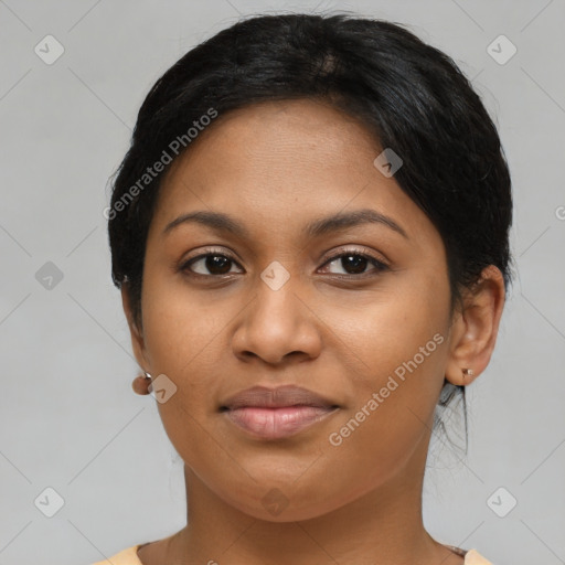 Joyful latino young-adult female with short  brown hair and brown eyes