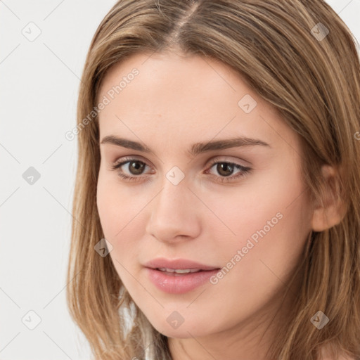 Neutral white young-adult female with long  brown hair and brown eyes