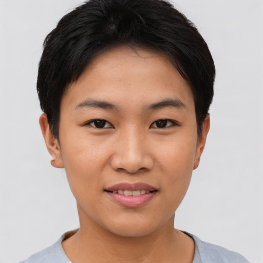 Joyful asian young-adult female with short  black hair and brown eyes